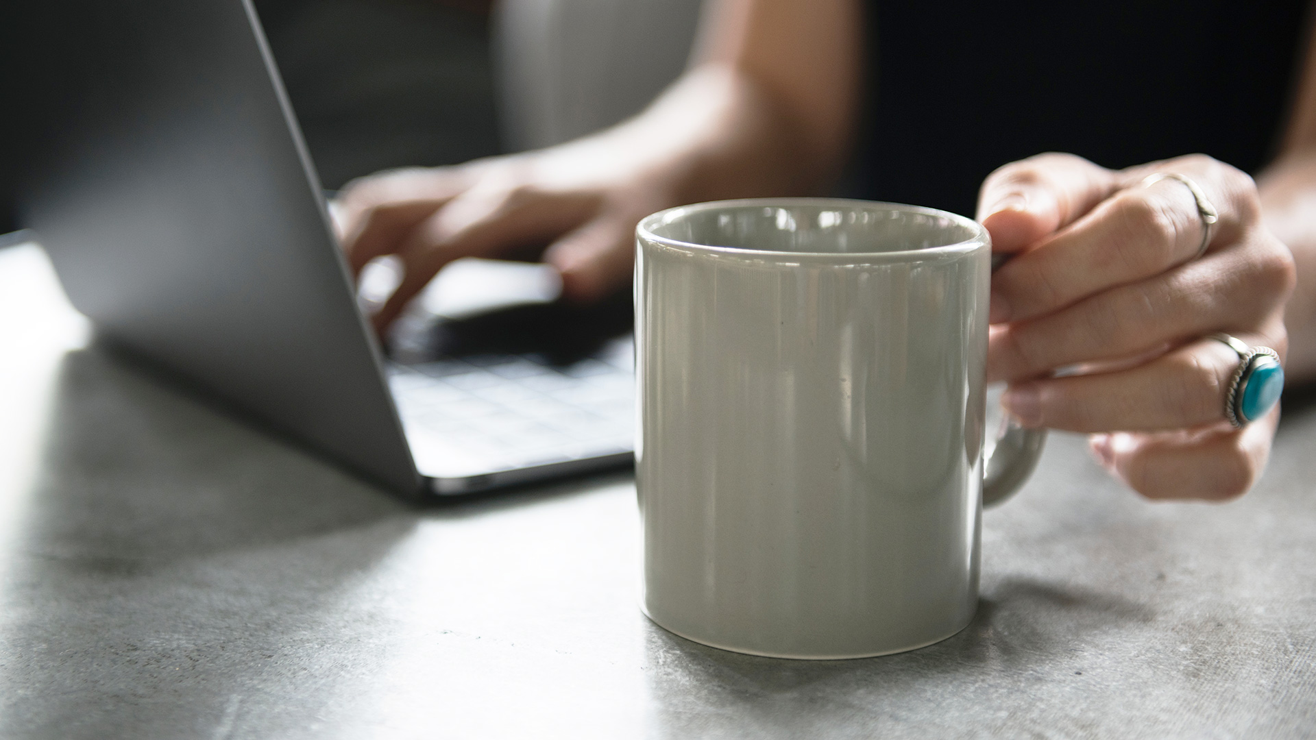 Woman using insurance calculator on laptop