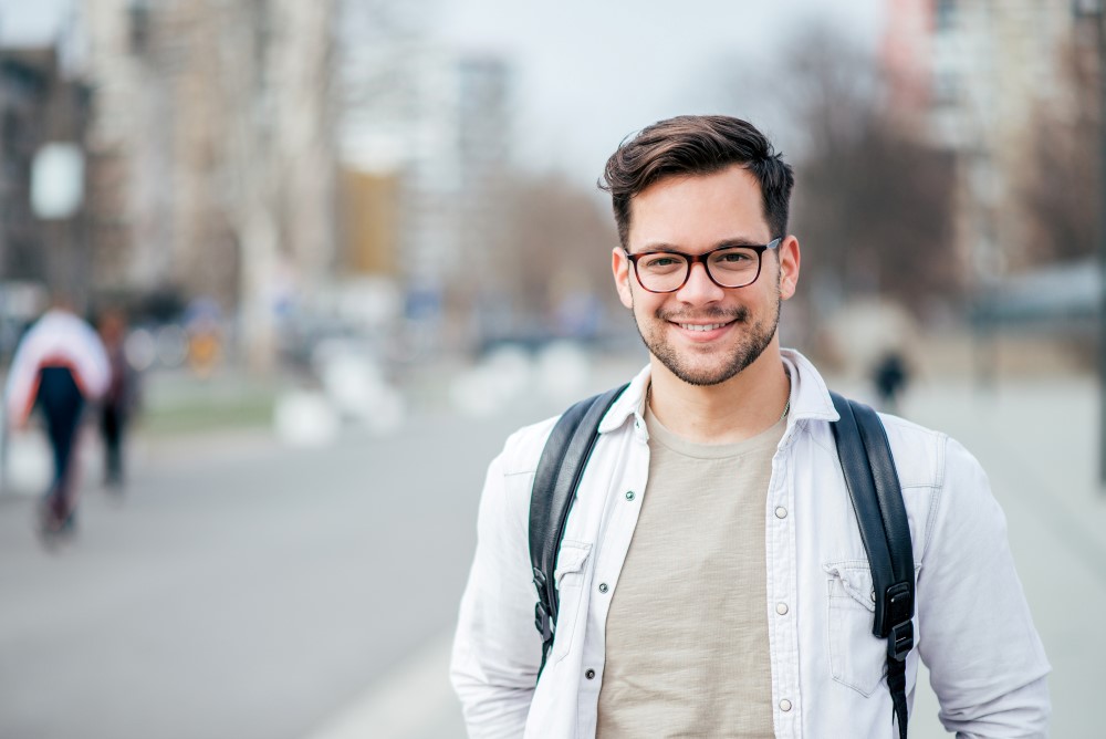 Young man wearing glasses outdoors