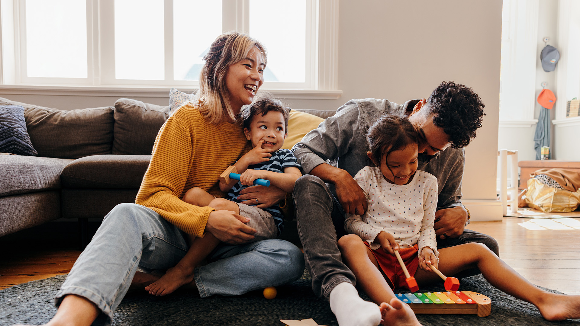 Family playing with children at home