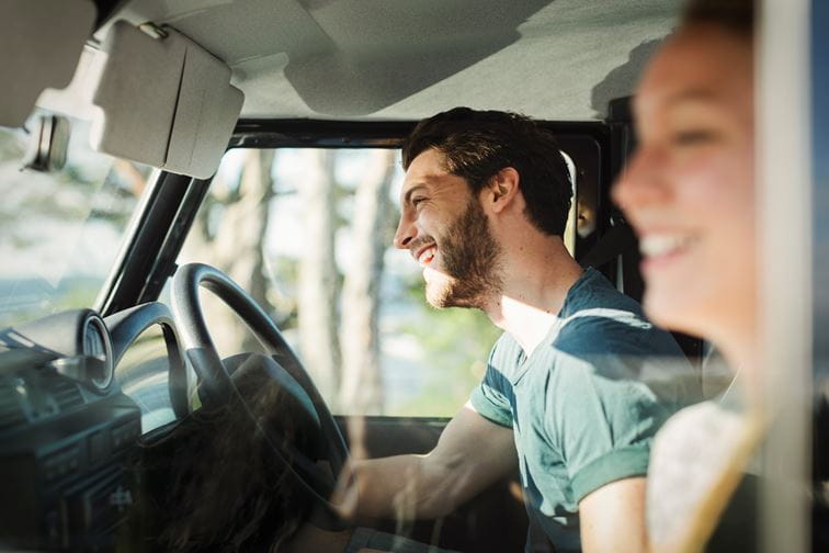 Happy couple in car together