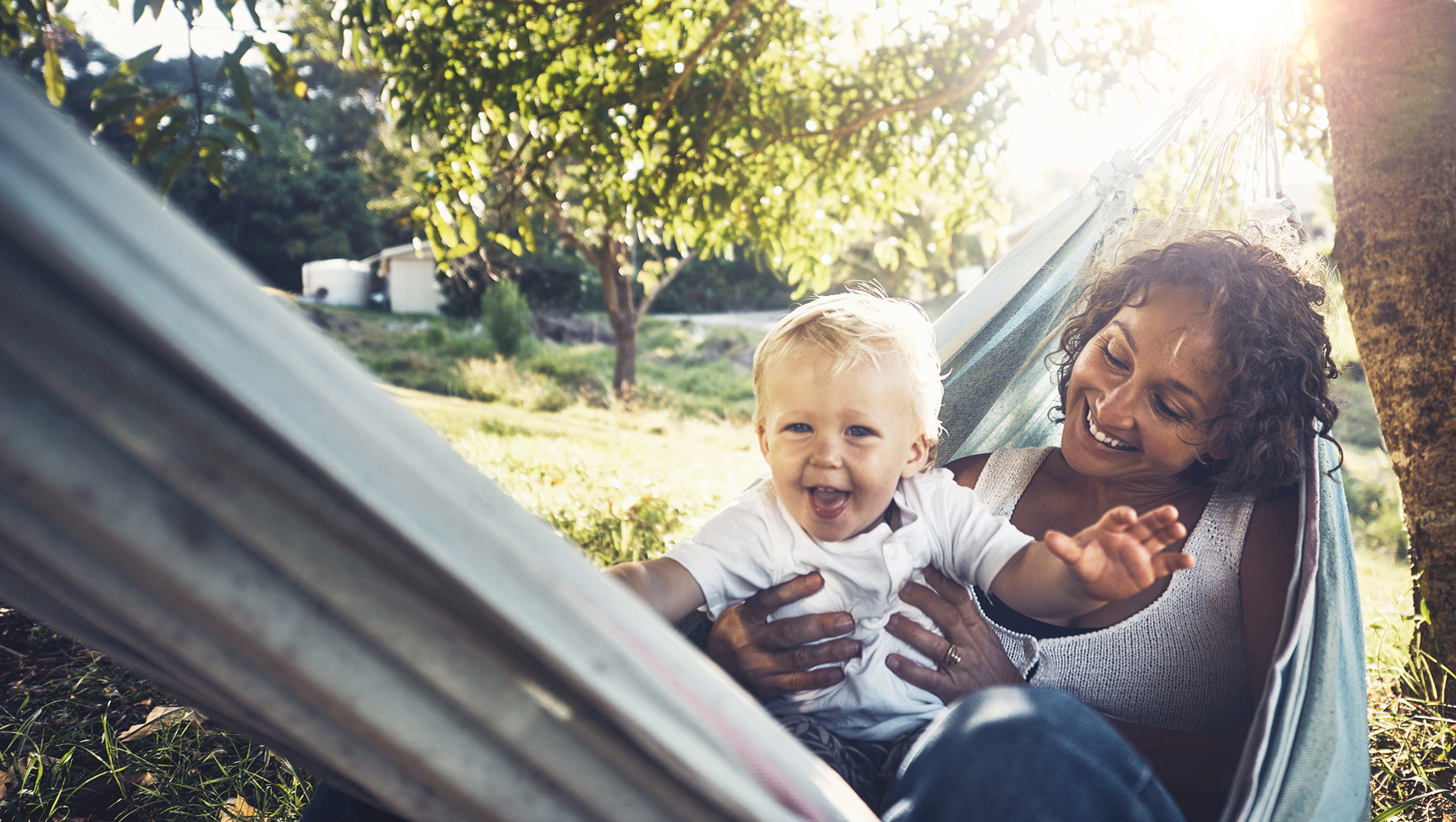 Super insured woman and child sitting outside playing