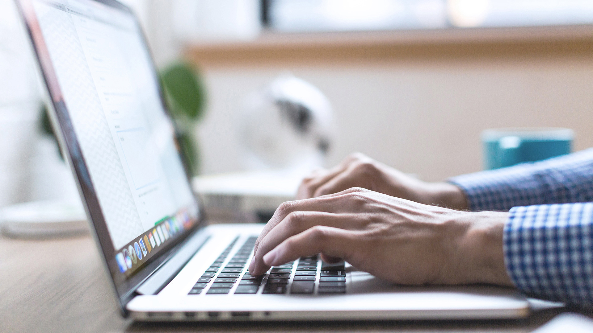 Man comparing superannuation plans on laptop
