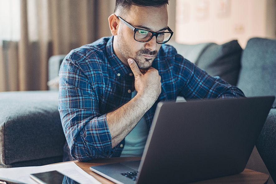 Man looking at a laptop computer