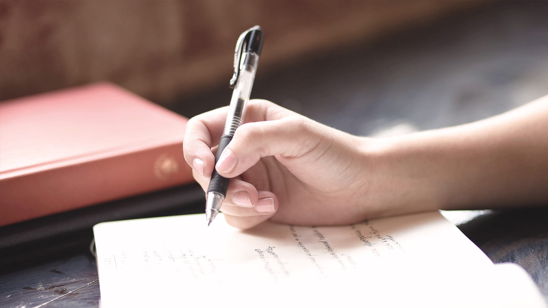 Photo of hand writing on paper