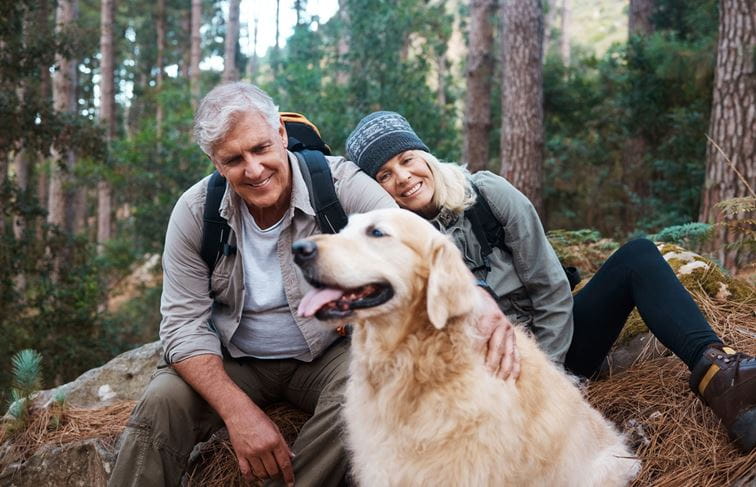 Couple hiking with dog