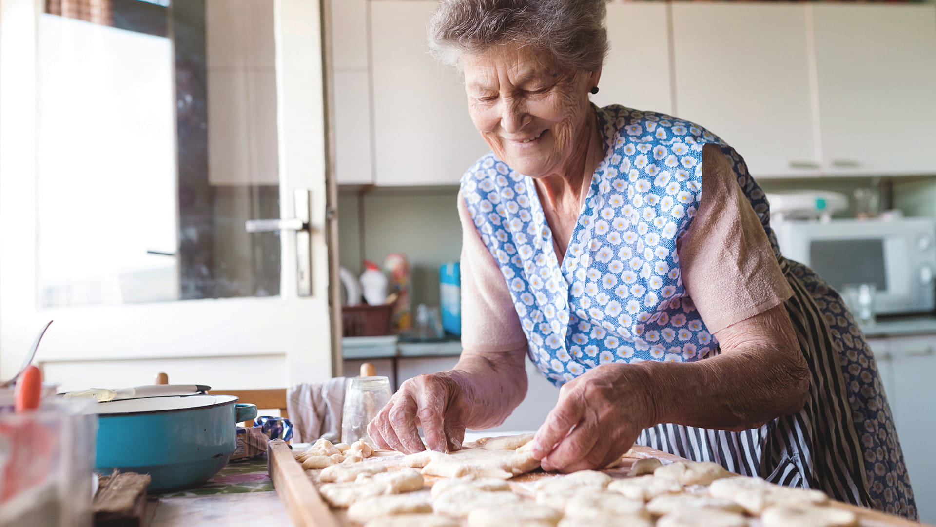 Senior woman making food