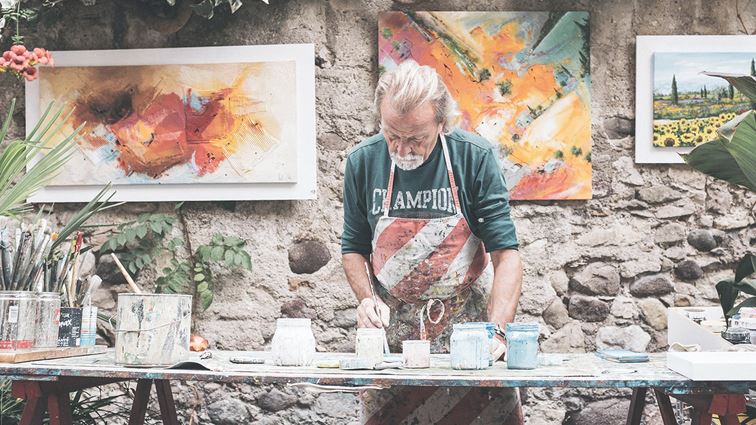 Senior man painting