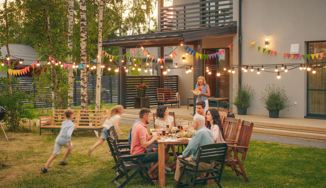 Family having dinner in the backyard