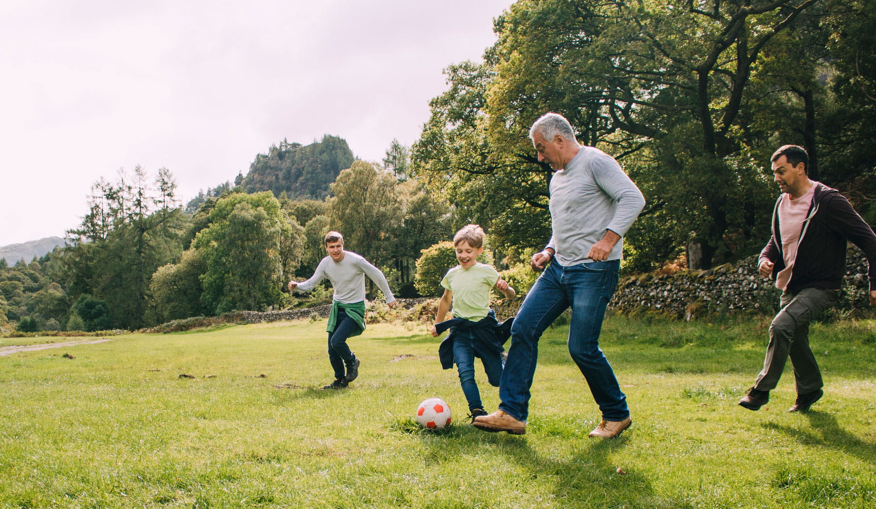 Family playing soccer
