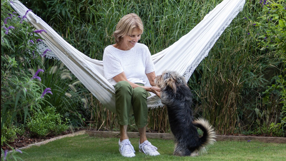 Woman with her dog playing
