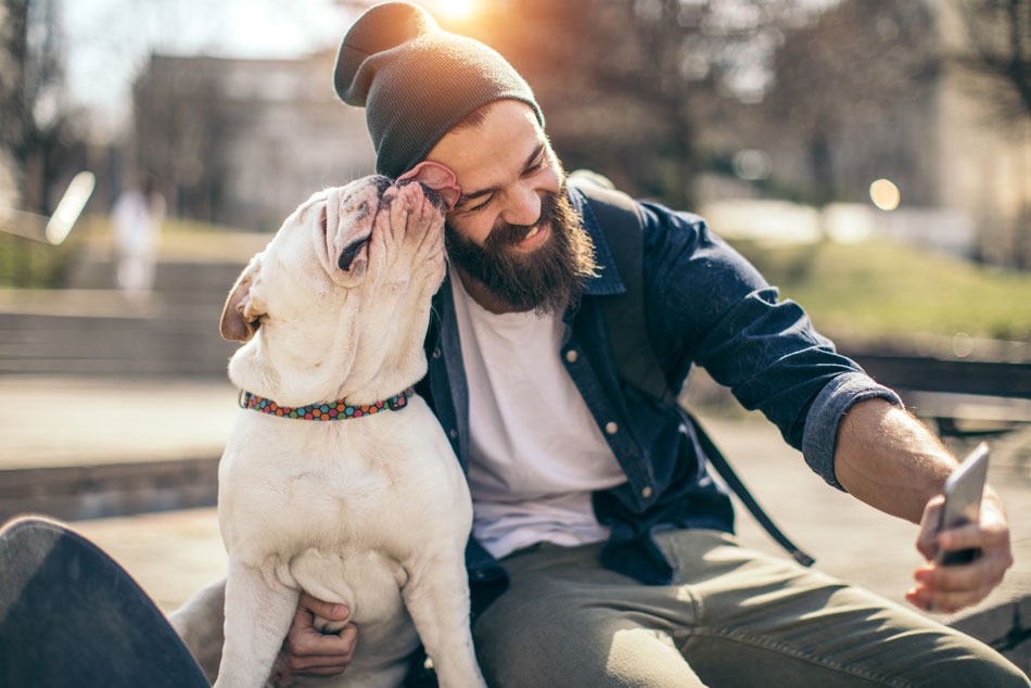 Man with his dog taking selfie