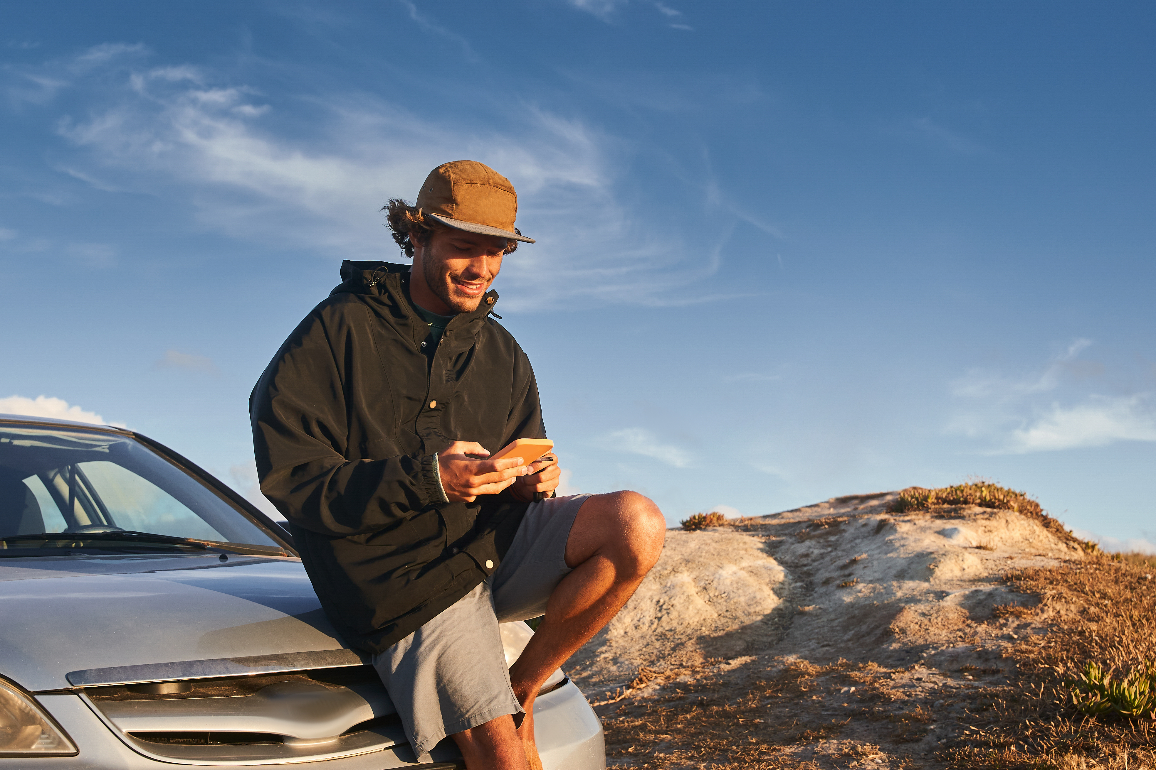 Young driver sitting on the car
