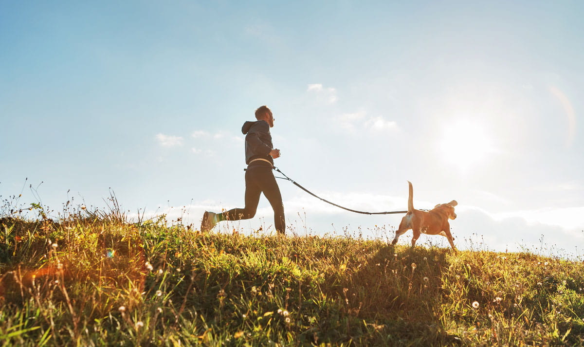 Man running with dog