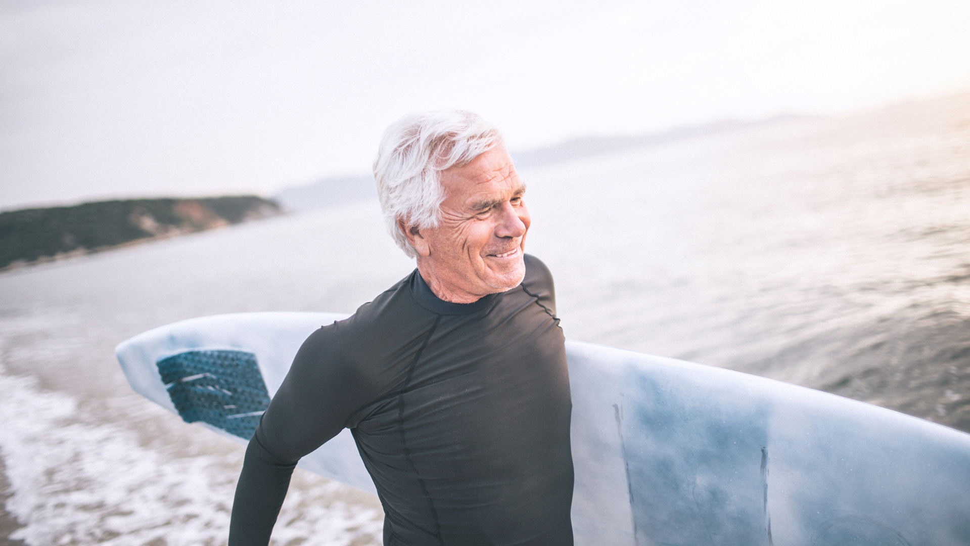 Senior man going surfing