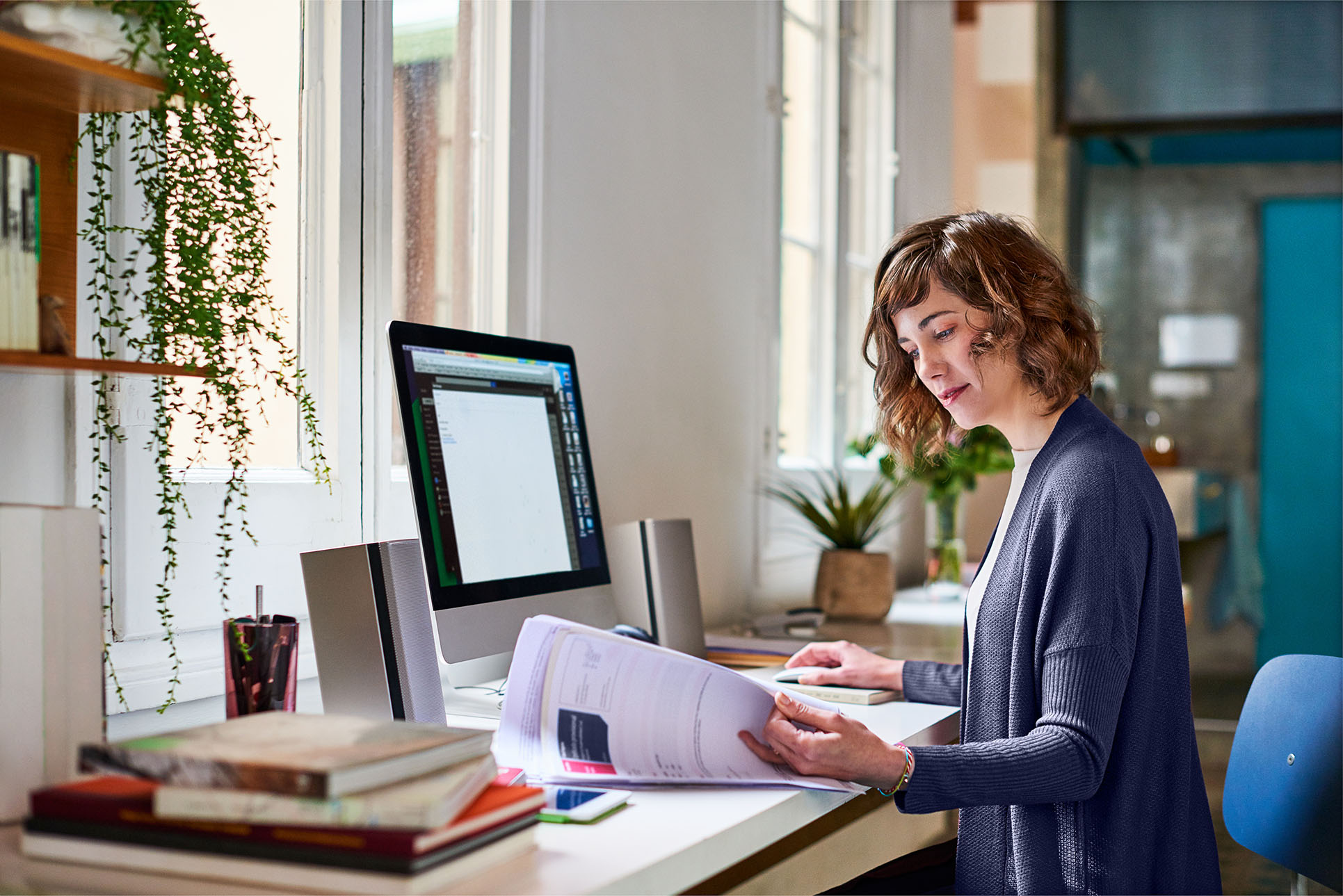 Lady at desk reading papers